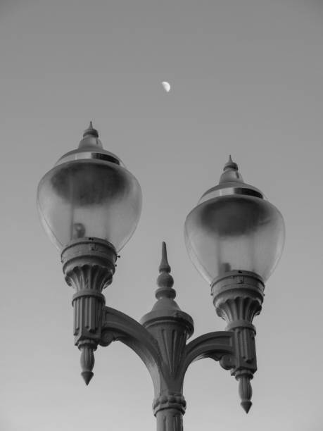 istock Lamppost in the foreground with the moon in the background 966403350
