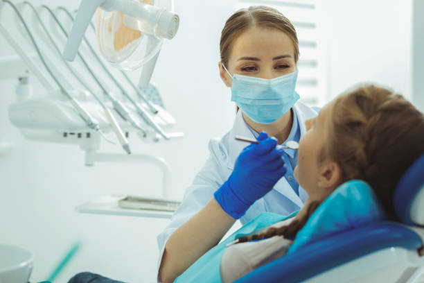 istock Scared girl visiting her stomatologist 966407352