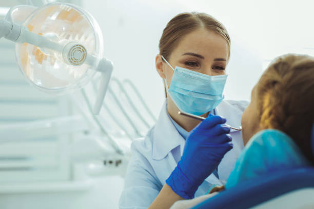 istock Attentive female person working in dentist surgery 966407554