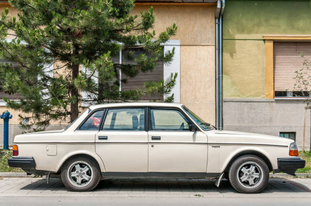 White Volvo 240 car model parked on the street White Volvo 240 car model parked on the street. May - 24. 2018. Novi Sad, Serbia. volvo stock pictures, royalty-free photos & images