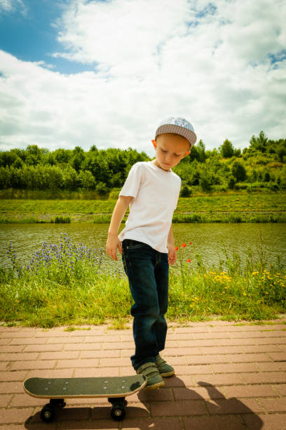 istock Skater boy child with his skateboard. Outdoor activity. 966407930