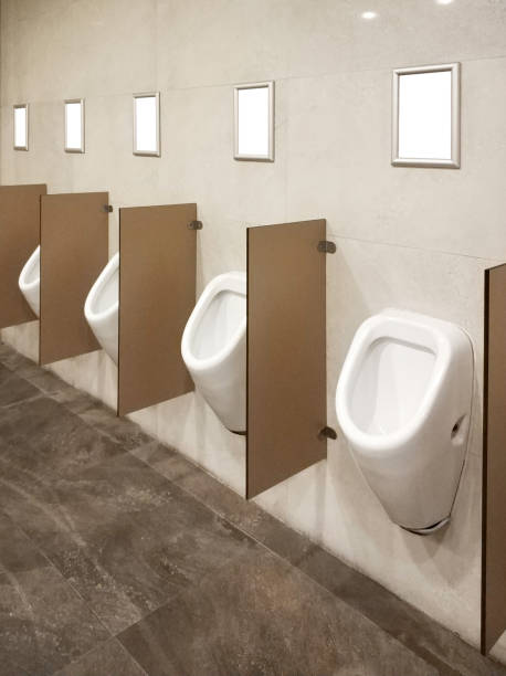 urinals and advertisement frames with clipping path - urinal clean contemporary in a row imagens e fotografias de stock