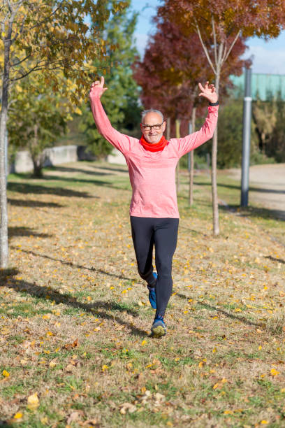 istock Senior runner man arms up after running 966418950