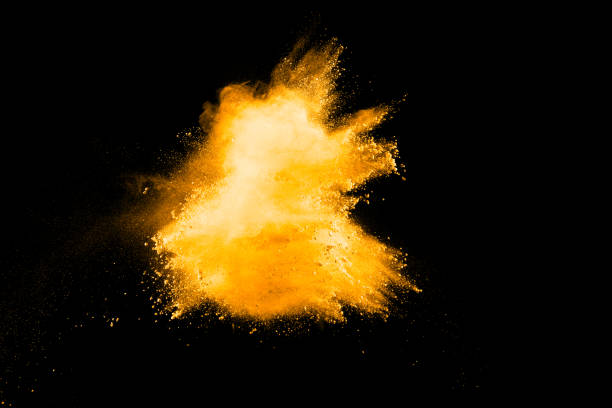 istock abstract orange dust explosion on  black background. abstract orange powder splattered on black background, Freeze motion of orange powder splash. 966419508