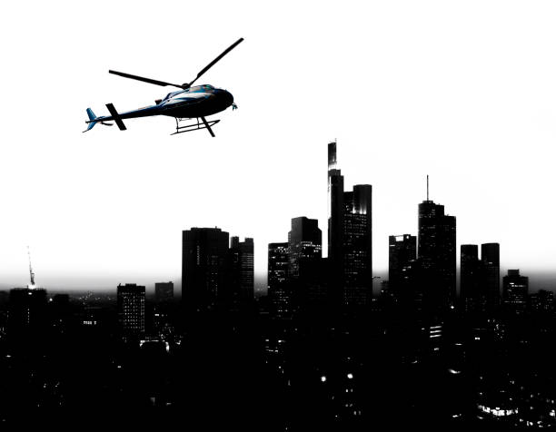 istock helicopter and city skyline silhouette 966419860