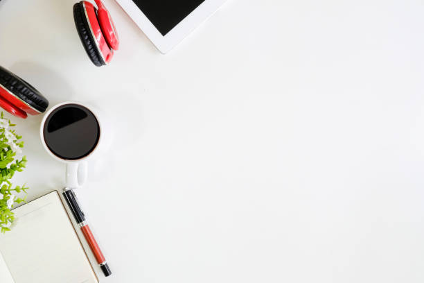 istock Modern white office desk table with other supplies with cup of coffee. Blank space for input the text in empty. Top view, flat lay. 966423168