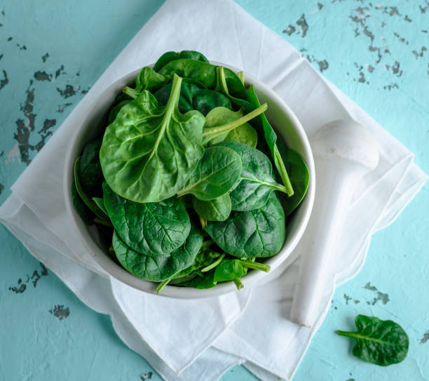 istock fresh green spinach leaves in a white ceramic mortar 966426076