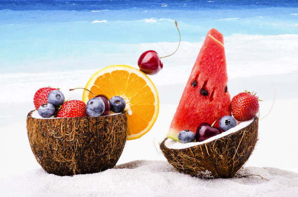 on the coral beach, a coconut contains fresh fruit