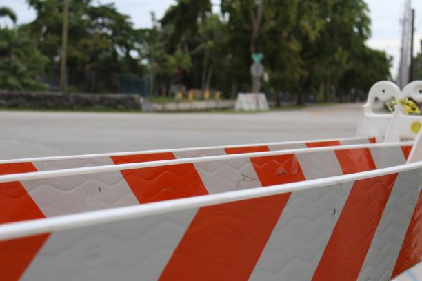 istock group of plastic, orange and white a-frame traffic barriers 966434338