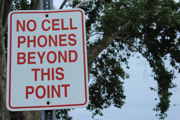 istock No cell phones beyond this point sign on pole 966434368