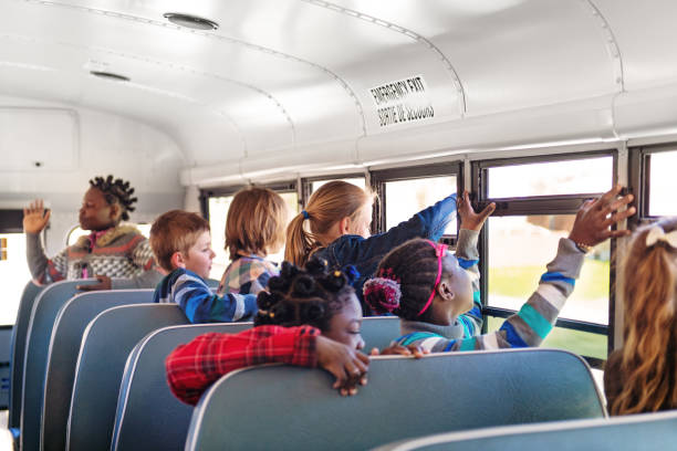 istock School kids in a bus 966434660