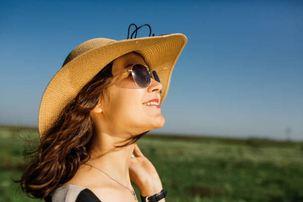 istock Beautiful woman with summer hat 966436920