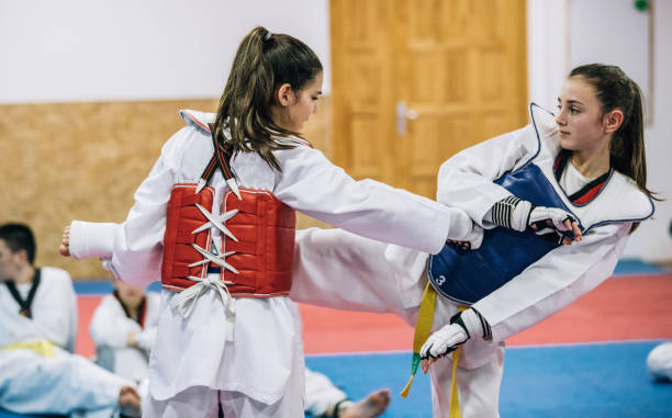istock Girls teaching taekwondo 966438632
