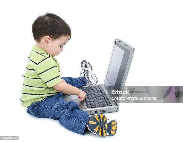 Adorable Boy With Working On Laptop Over White Stock Photo - Download Image Now - Beautiful People, Boys, Casual Clothing