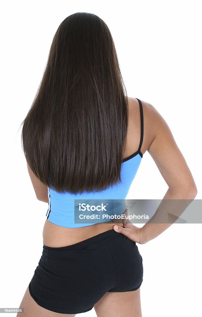 Vista traseira de uma garota adolescente em roupas de ginástica - Foto de stock de Acima royalty-free