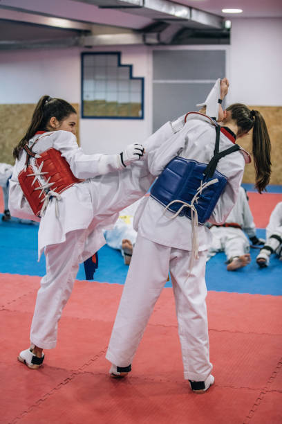istock Girls teaching martial arts 966449292