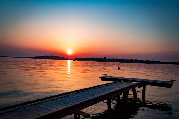 istock An old wooden brigde with the sunset 966449632