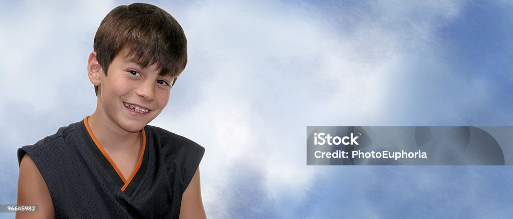 Boy with Braces on a Mottled Blue and White Background  American Culture Stock Photo