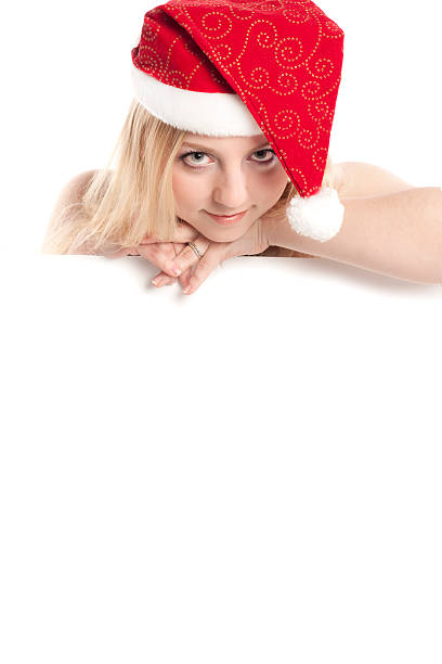 istock blond woman in santa hat 96647773