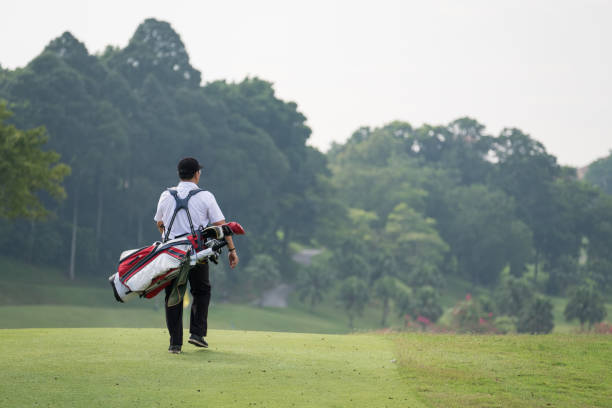 istock Enjoying the walk down the green fairway 966478784