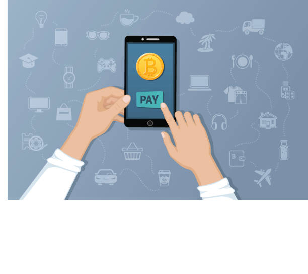 istock Payment by Bitcoins. Pay for goods and services by crypto currency. Payment service international transfers by electronic virtual currency. Hands holding a phone with a gold coin bitcoin. 966482502