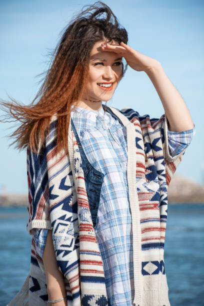 istock Girl relaxing by the sea 966482752