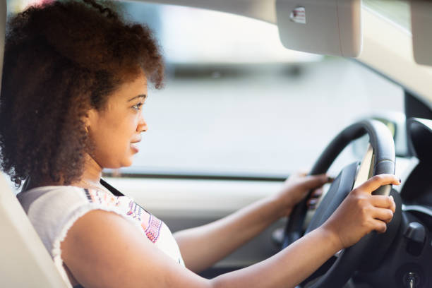 istock african woman driving car 966489510