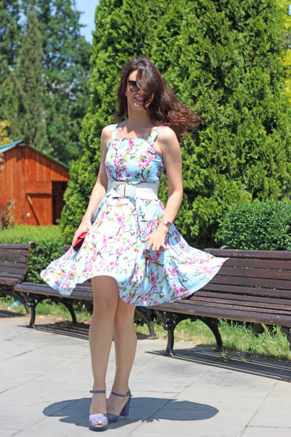 istock Young woman spinning in the park 966489752