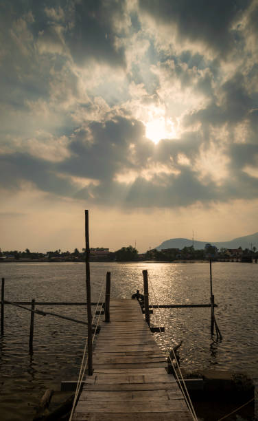 pier and river landscape view at sunset in kampot town cambodia