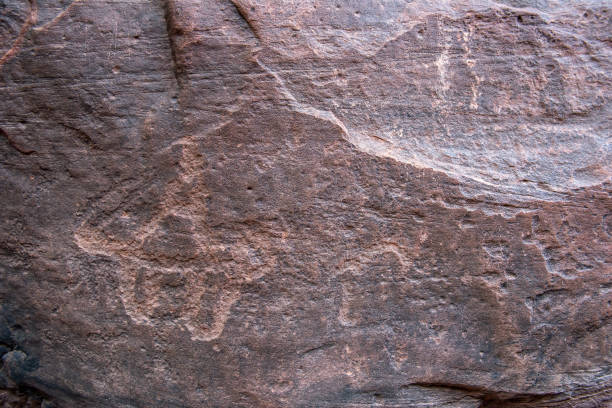 istock Nabatean and Thamudic inscriptions on rock in Wadi Rum desert 966493948