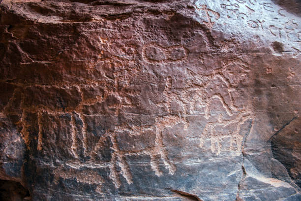 istock Nabatean and Thamudic inscriptions on rock in Wadi Rum desert 966493968