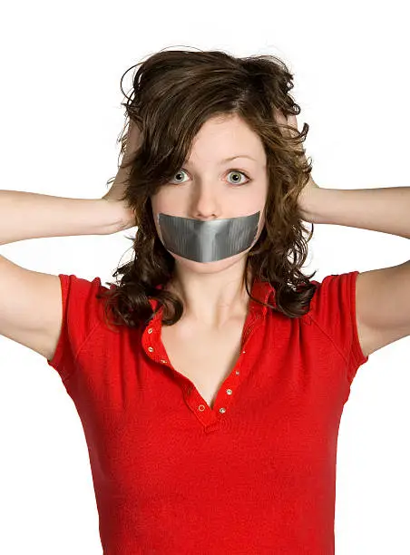 Teenage girl's mouth covered by duct tape