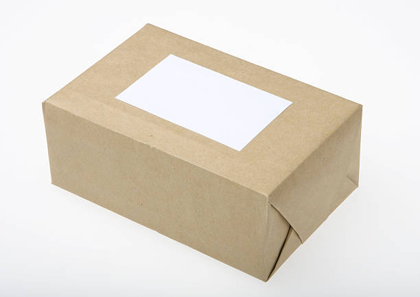 istock Parcel wrapped in brown paper with blank paper for address 96650300