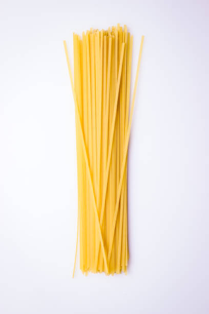 istock Top View of Isolated Raw Pasta Spaghetti on a White Background 966503084