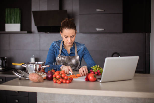 istock Woman preparing lunch in the kitchen 966506362