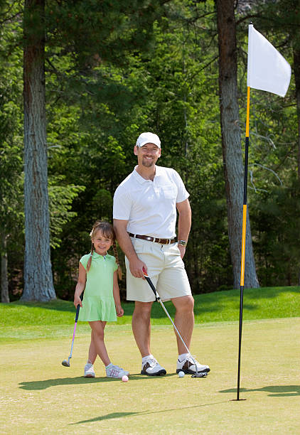 istock Father and Daughter Golfing 96650772