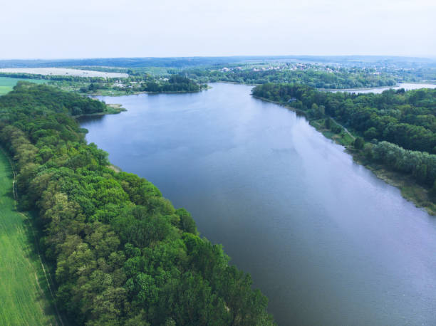 istock aerial view of river. small town on background 966510442