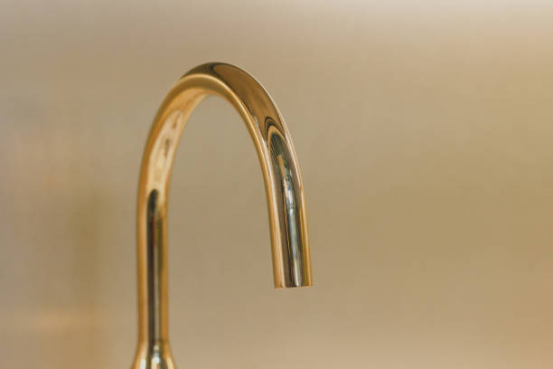 istock Modern metal faucet in a kitchen close-up 966510506