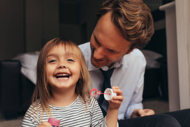 istock Father and daughter playing at home 966523862