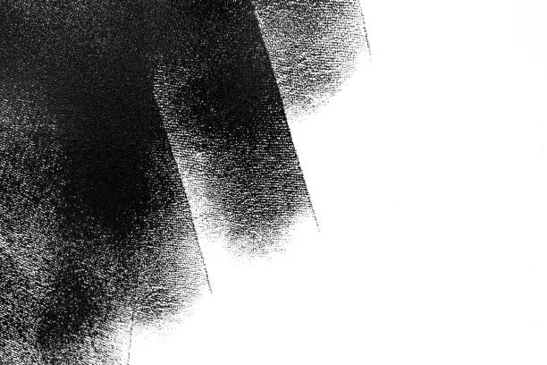 istock White wall partially painted in black with a paint roller 966524448