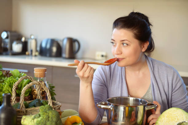 istock woman cooking in the kitchen 966532394