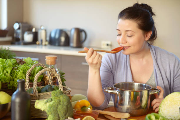 istock woman cooking in the kitchen 966532580