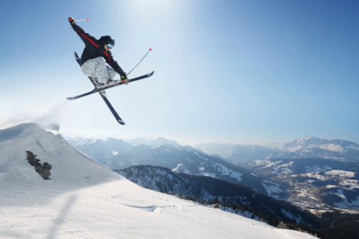 Snowboarder jumping in snow park