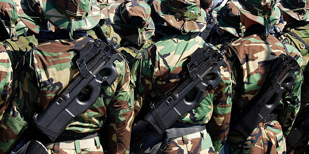 istock Military soldiers with uniforms and guns. 96653768