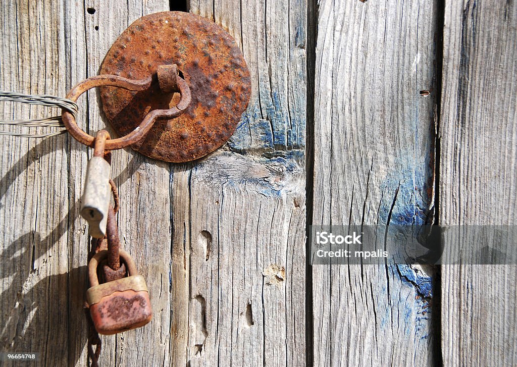 Old rusty wooden door with padlock  Abstract Stock Photo