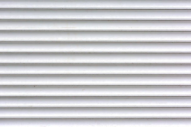istock A wall made of smooth slats. Background of light gray horizontal bars. 966555280