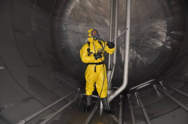 man in chemical suit stock photo