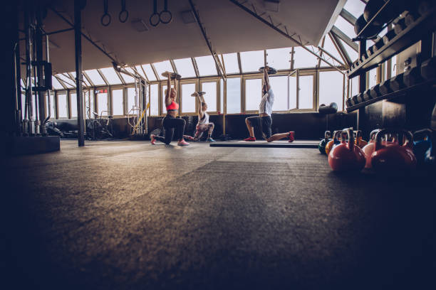 istock Women exercising with personal trainer 966558502