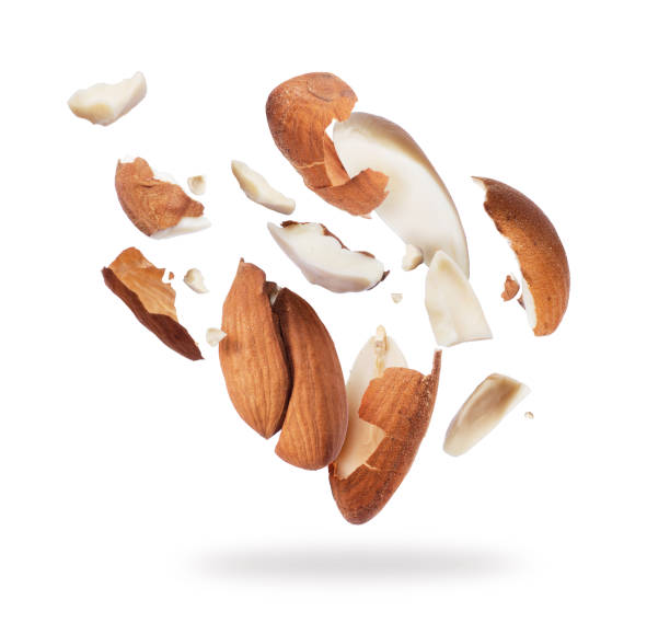 istock Almonds crushed into pieces close-up isolated on white background 966558538