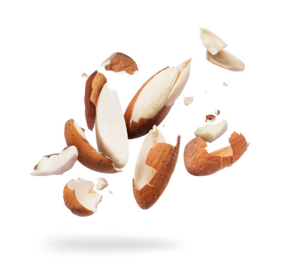 istock Almonds crushed into pieces close-up on white background 966558546